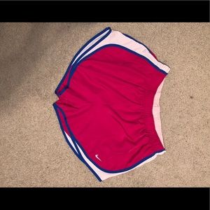 Pink and blue Nike running shorts